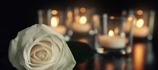 Flowers and Candles at a funeral with a variety of options for the type of service you have